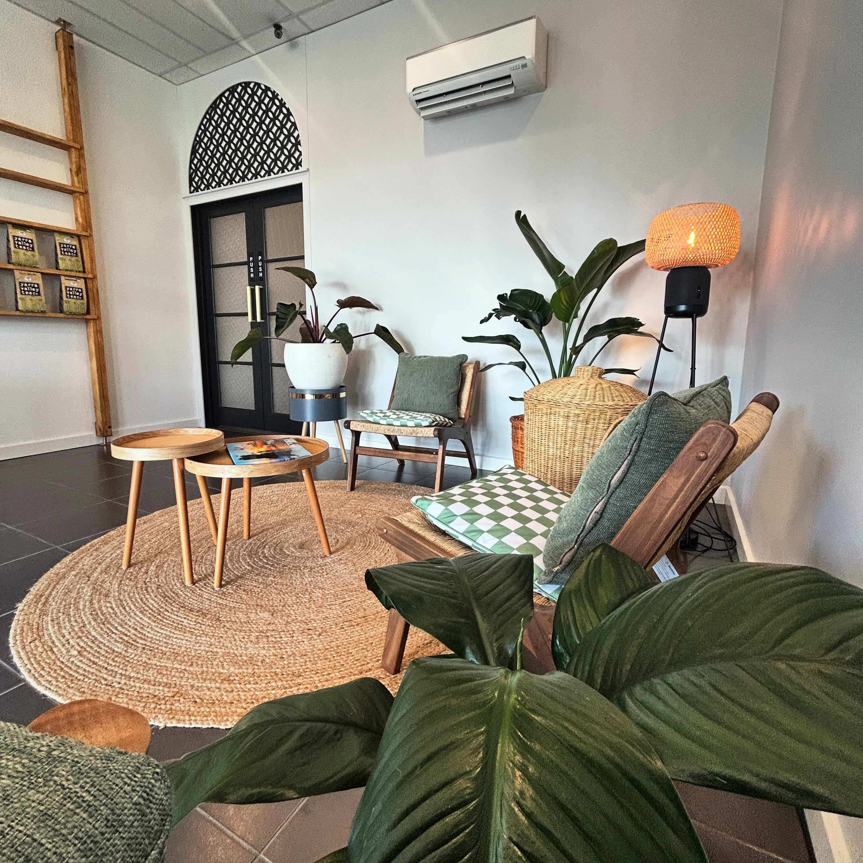 Kew waiting area with the Yarra Valley Tea ladder shelf, nesting tables and sage cushions